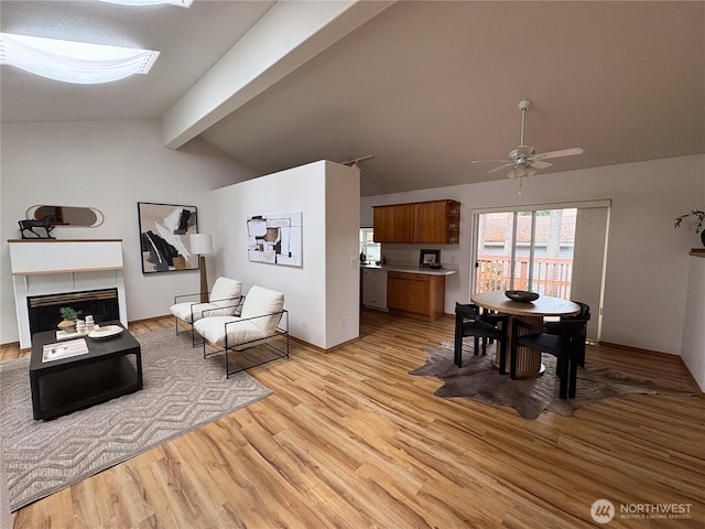 933 Fern St SW, Olympia, WA 98502 - living area featuring light wood-type flooring, a fireplace, and ceiling fan