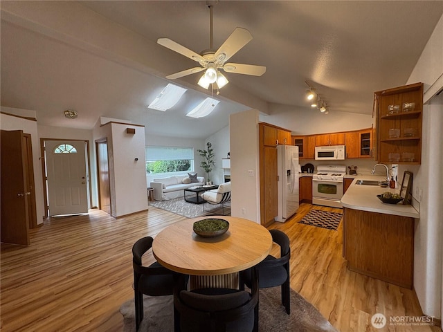 933 Fern St SW, Olympia, WA 98502 - dining room with vaulted ceiling, light wood-type flooring, and ceiling fan