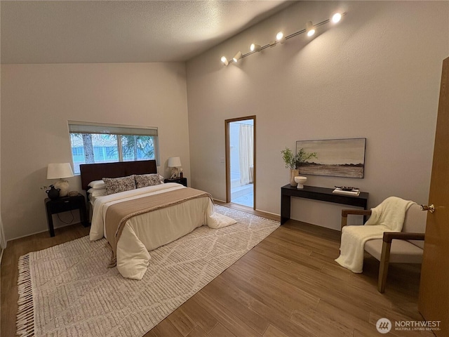 933 Fern St SW, Olympia, WA 98502 - bedroom with wood finished floors and high vaulted ceiling