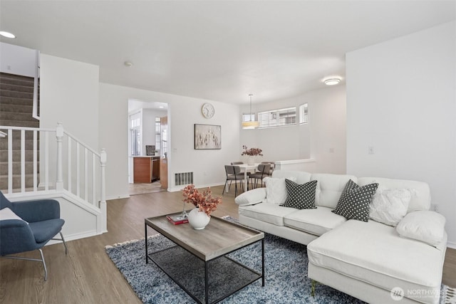 352 227th Ln NE Unit 142, Sammamish, WA 98074 - living area featuring stairs and wood finished floors