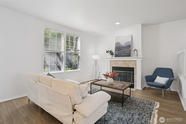 352 227th Ln NE Unit 142, Sammamish, WA 98074 - living area featuring wood finished floors, a tiled fireplace, and recessed lighting