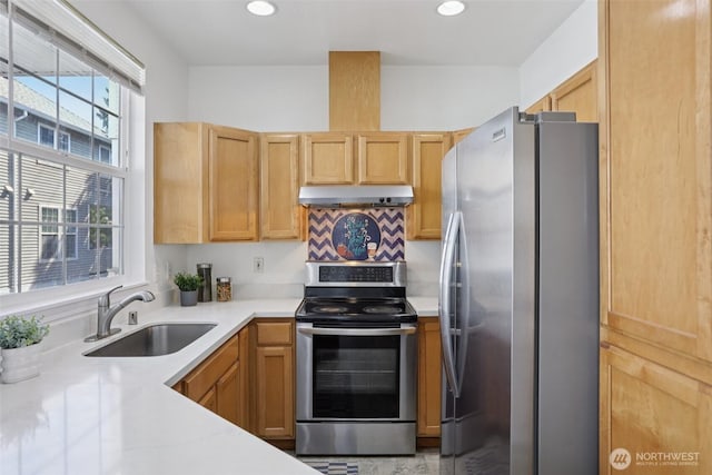 352 227th Ln NE Unit 142, Sammamish, WA 98074 - kitchen featuring appliances with stainless steel finishes, light countertops, under cabinet range hood, recessed lighting, and decorative backsplash