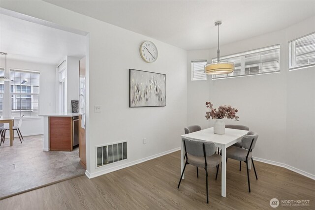 352 227th Ln NE Unit 142, Sammamish, WA 98074 - dining space with wood finished floors and baseboards