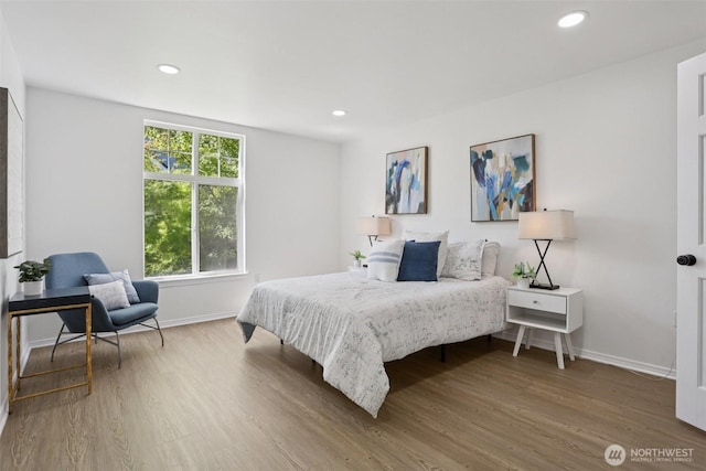352 227th Ln NE Unit 142, Sammamish, WA 98074 - bedroom with wood finished floors and recessed lighting