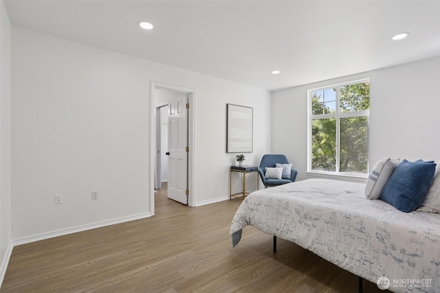 352 227th Ln NE Unit 142, Sammamish, WA 98074 - bedroom featuring wood finished floors and recessed lighting