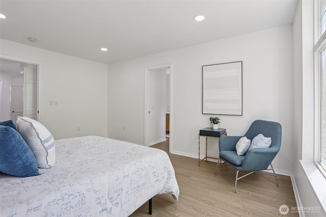 352 227th Ln NE Unit 142, Sammamish, WA 98074 - bedroom with wood finished floors and recessed lighting