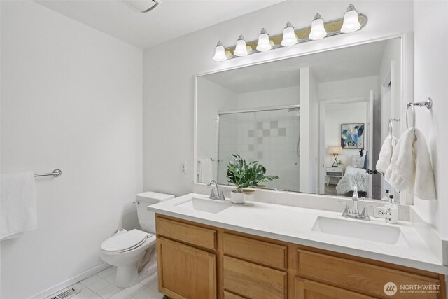 352 227th Ln NE Unit 142, Sammamish, WA 98074 - ensuite bathroom with double vanity, an enclosed shower, and tile patterned flooring