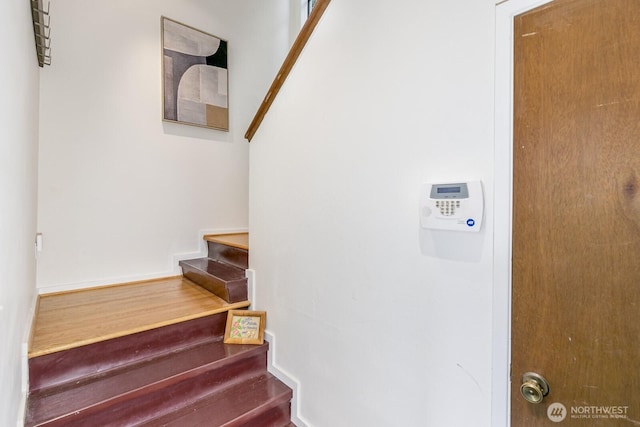 6367 Sand Point Way NE, Seattle, WA 98115 - staircase with wood finished floors