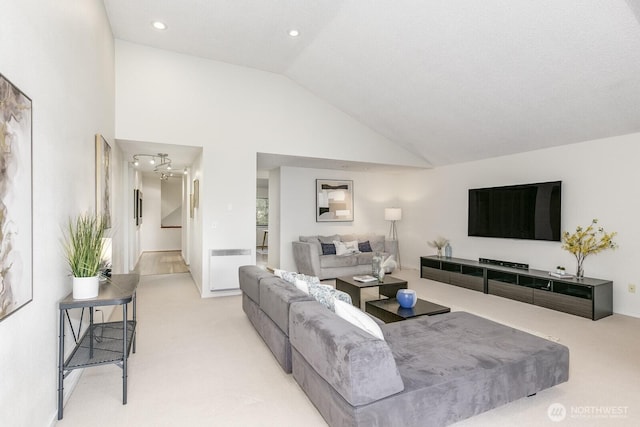 6367 Sand Point Way NE, Seattle, WA 98115 - carpeted living area with lofted ceiling and recessed lighting