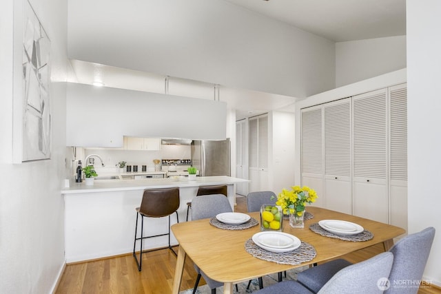 6367 Sand Point Way NE, Seattle, WA 98115 - dining space featuring light wood-style flooring