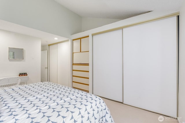 6367 Sand Point Way NE, Seattle, WA 98115 - bedroom with multiple closets, lofted ceiling, and recessed lighting