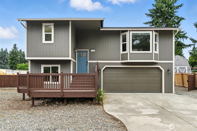 21905 128th St E, Bonney Lake, WA 98391 - split foyer home with an attached garage, driveway, and a wooden deck