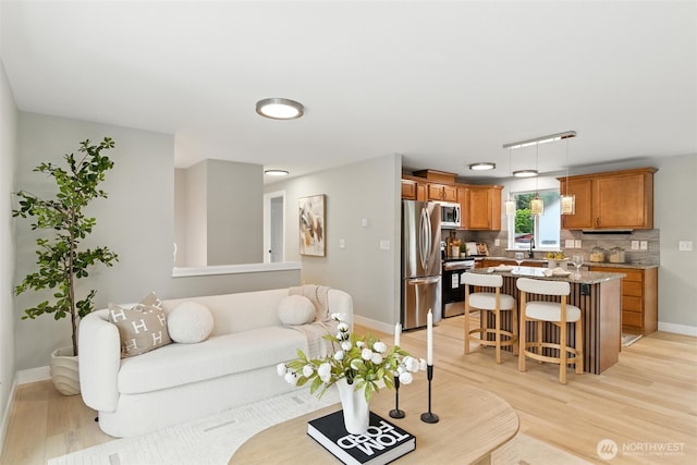 21905 128th St E, Bonney Lake, WA 98391 - living area featuring light wood finished floors and baseboards