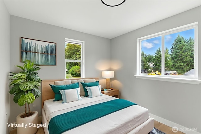 21905 128th St E, Bonney Lake, WA 98391 - bedroom featuring wood finished floors and baseboards