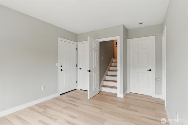 21905 128th St E, Bonney Lake, WA 98391 - empty room featuring light wood-type flooring and stairs