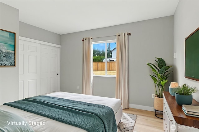 21905 128th St E, Bonney Lake, WA 98391 - bedroom with light wood-type flooring and a closet