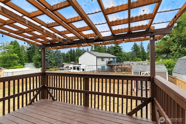 21905 128th St E, Bonney Lake, WA 98391 - wooden terrace with a fenced backyard, a shed, a pergola, and view of wooded area
