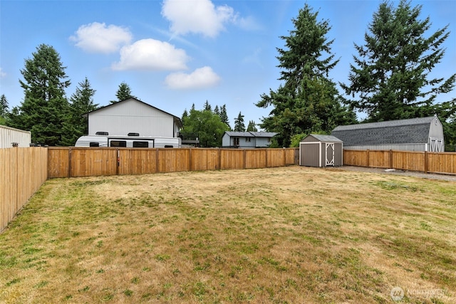 21905 128th St E, Bonney Lake, WA 98391 - fenced backyard featuring a storage unit