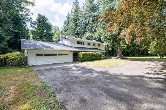 3928 Sorenson Rd, Everson, WA 98247 - traditional home featuring driveway, a garage, and a chimney
