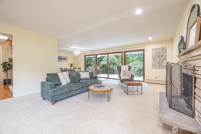 3928 Sorenson Rd, Everson, WA 98247 - living room featuring a fireplace, light colored carpet, baseboard heating, and recessed lighting