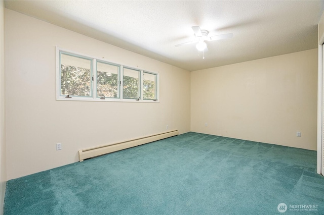 3928 Sorenson Rd, Everson, WA 98247 - carpeted spare room featuring baseboard heating and a ceiling fan