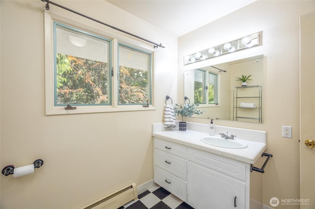 3928 Sorenson Rd, Everson, WA 98247 - bathroom featuring tile patterned floors, vanity, and baseboard heating