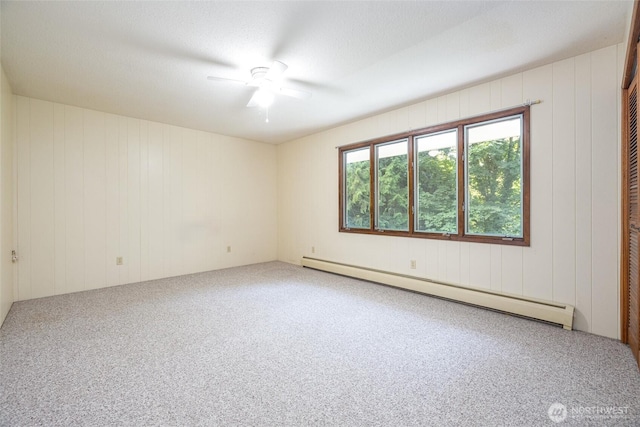 3928 Sorenson Rd, Everson, WA 98247 - carpeted empty room featuring baseboard heating and ceiling fan