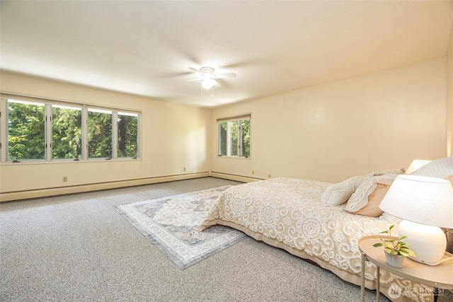 3928 Sorenson Rd, Everson, WA 98247 - carpeted bedroom with a baseboard radiator and a ceiling fan