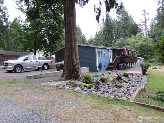4917 107th Ave SE, Snohomish, WA 98290 - view of side of home featuring stairway and a wooden deck