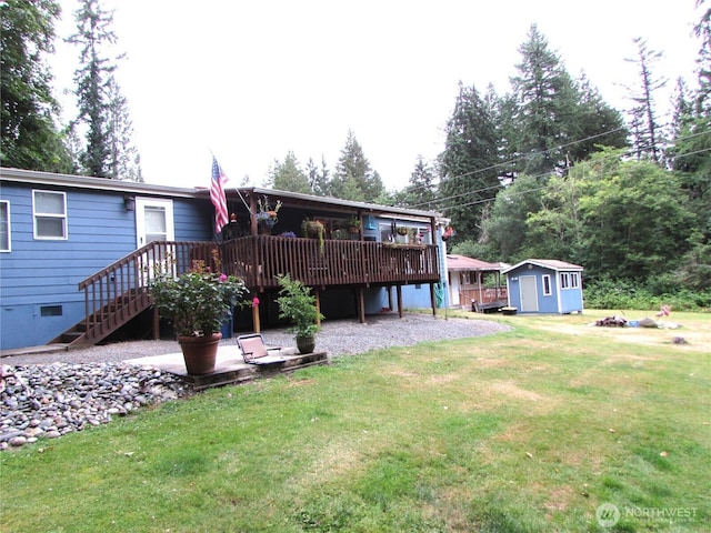 4917 107th Ave SE, Snohomish, WA 98290 - back of property with a storage shed, a lawn, a deck, and crawl space