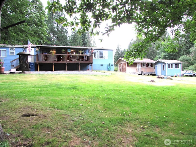 4917 107th Ave SE, Snohomish, WA 98290 - view of grassy yard featuring a wooden deck and a shed