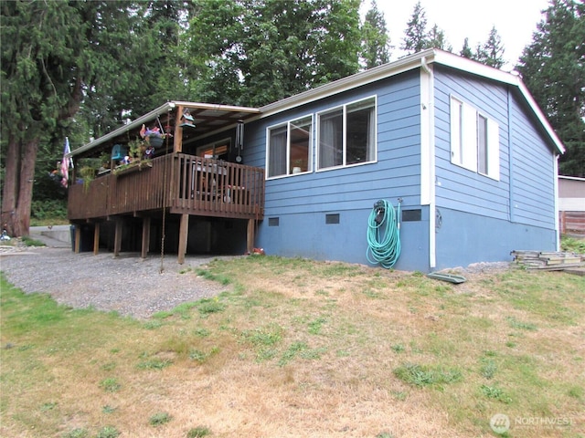4917 107th Ave SE, Snohomish, WA 98290 - rear view of house with a wooden deck, a lawn, and crawl space