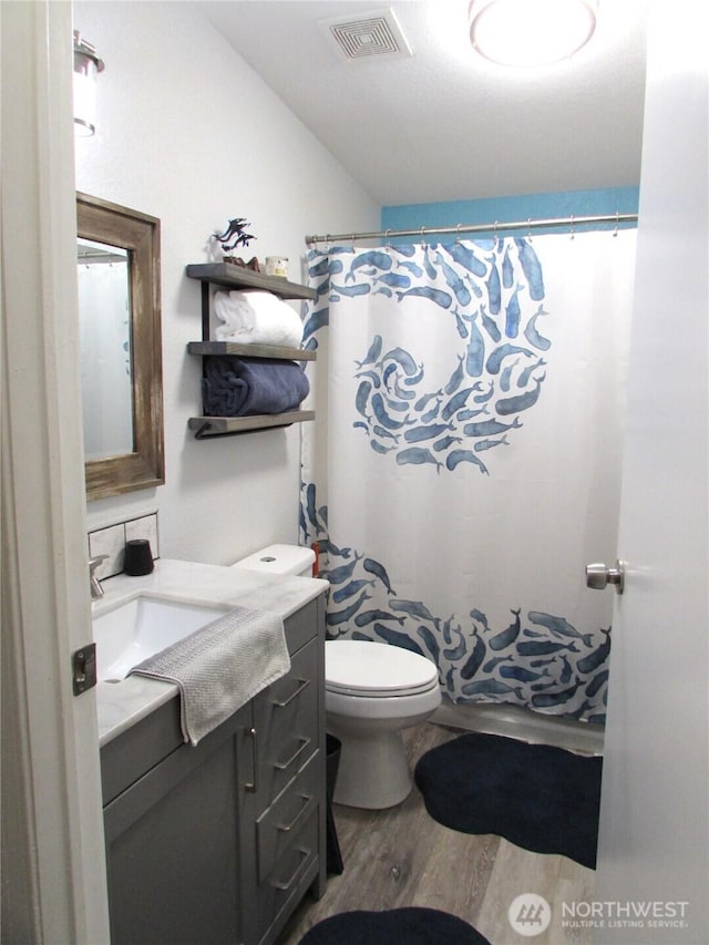 4917 107th Ave SE, Snohomish, WA 98290 - full bath featuring vanity, wood finished floors, and a shower with curtain