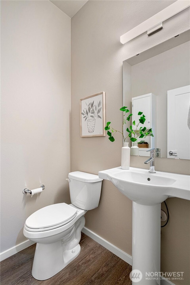 6855 NE 170th St Unit 102, Kenmore, WA 98028 - bathroom featuring toilet and wood finished floors