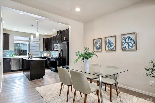 6855 NE 170th St Unit 102, Kenmore, WA 98028 - dining room featuring light wood-style flooring and recessed lighting