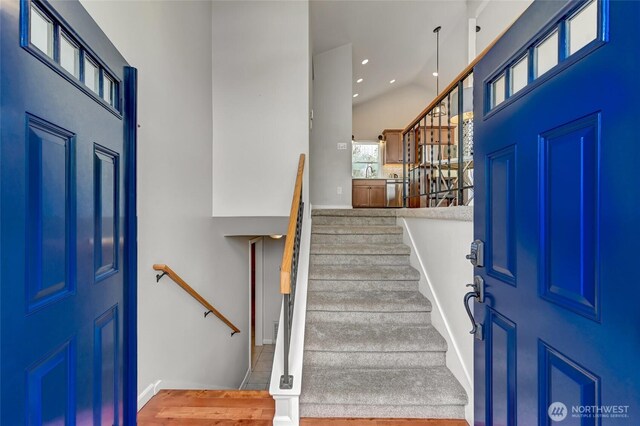 13506 89th Pl NE, Kirkland, WA 98034 - entryway featuring wood finished floors, stairway, a high ceiling, and recessed lighting