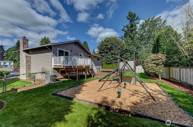 13506 89th Pl NE, Kirkland, WA 98034 - view of jungle gym with a wooden deck, a fenced backyard, and stairs