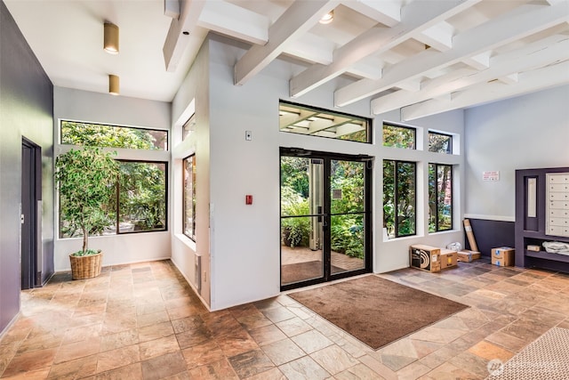 211 E Summit Ave Unit S117, Seattle, WA 98102 - entryway with stone tile floors, beamed ceiling, and a towering ceiling