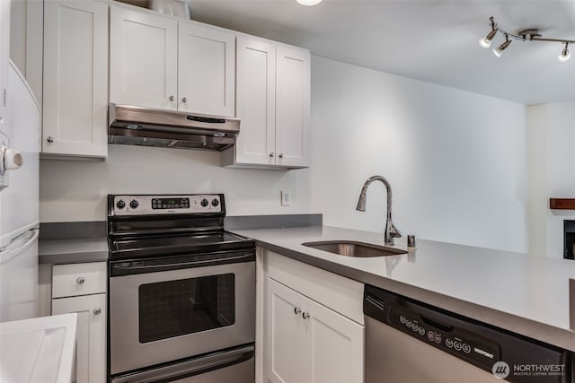 211 E Summit Ave Unit S117, Seattle, WA 98102 - kitchen featuring under cabinet range hood, appliances with stainless steel finishes, and white cabinets