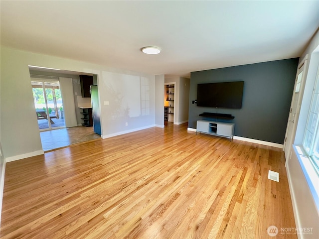 30135 2nd Ave SW, Federal Way, WA 98023 - unfurnished living room featuring wood finished floors