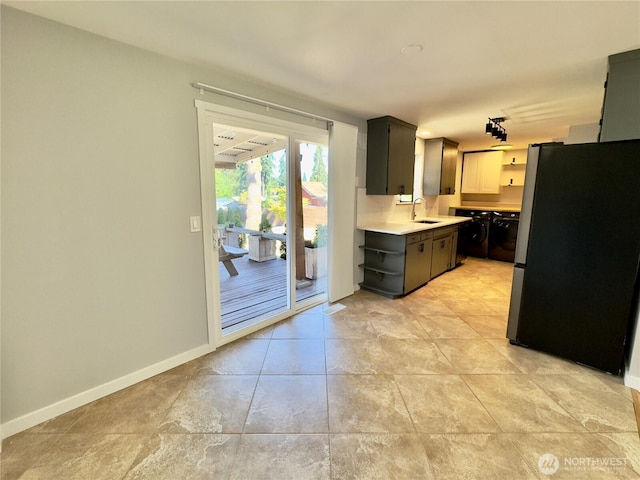 30135 2nd Ave SW, Federal Way, WA 98023 - kitchen with freestanding refrigerator, open shelves, light countertops, and light tile patterned floors