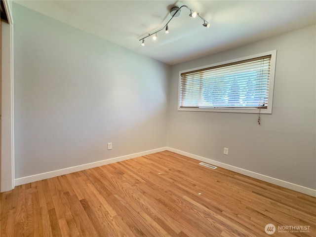 30135 2nd Ave SW, Federal Way, WA 98023 - unfurnished room featuring track lighting and light wood finished floors