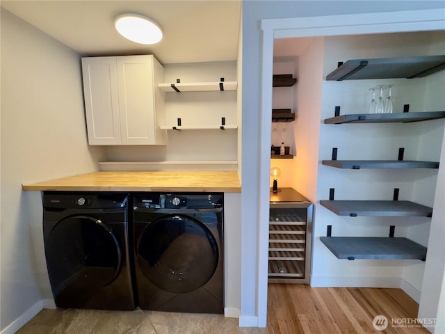 30135 2nd Ave SW, Federal Way, WA 98023 - laundry area featuring separate washer and dryer, cabinet space, wine cooler, light wood-type flooring, and bar area