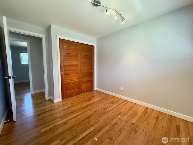 30135 2nd Ave SW, Federal Way, WA 98023 - unfurnished bedroom with a closet, light wood-style floors, and track lighting