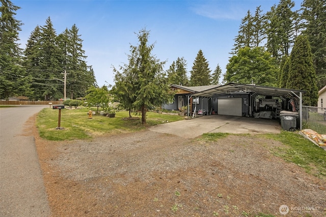 17112 Kinnikinnick Ct SE, Yelm, WA 98597 - view of front of house featuring a carport, a garage, and driveway