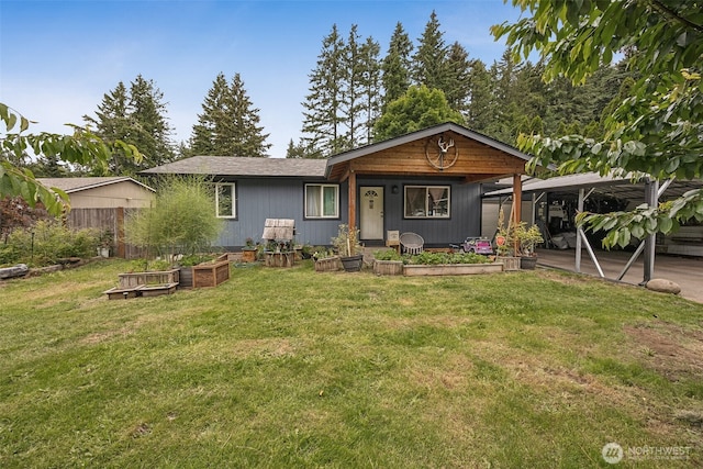 17112 Kinnikinnick Ct SE, Yelm, WA 98597 - view of front facade with a vegetable garden and a front lawn