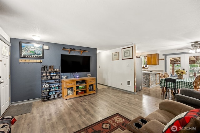 17112 Kinnikinnick Ct SE, Yelm, WA 98597 - living room with light wood-style flooring and a ceiling fan