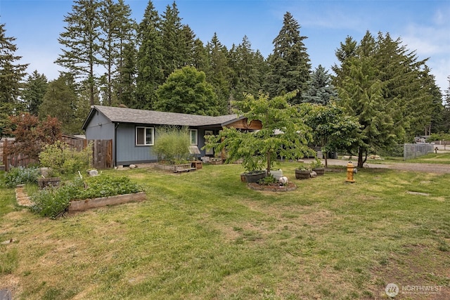 17112 Kinnikinnick Ct SE, Yelm, WA 98597 - view of front of house featuring a vegetable garden