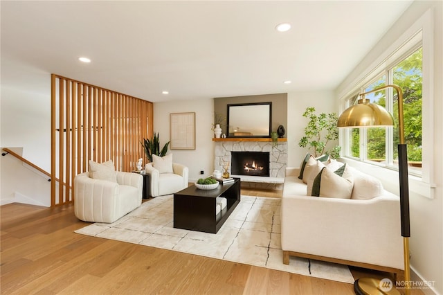 21 165th Ave SE, Bellevue, WA 98008 - living area featuring wood finished floors, a stone fireplace, and recessed lighting