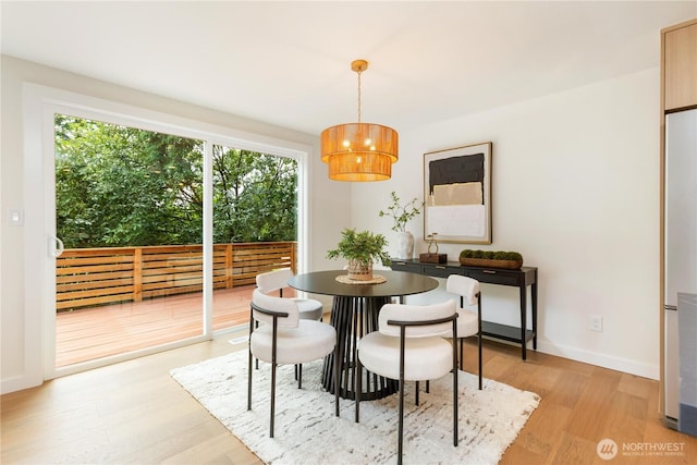 21 165th Ave SE, Bellevue, WA 98008 - dining area with light wood-style floors and baseboards